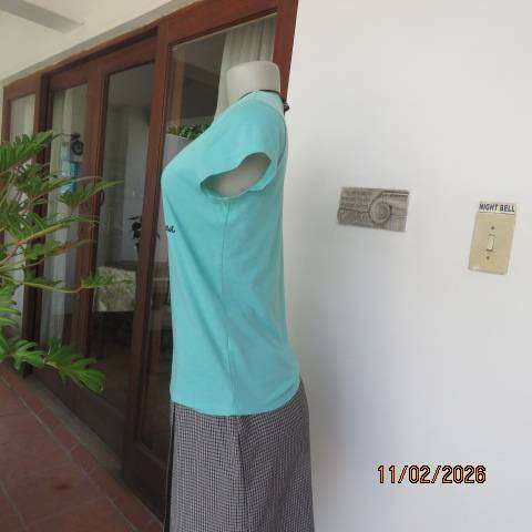 Aquamarine slip over capped sleeve polycotton top with black logo. Size 34