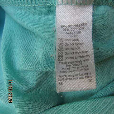 Aquamarine slip over capped sleeve polycotton top with black logo. Size 34