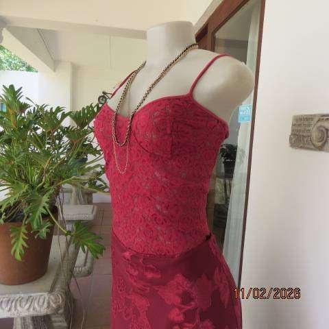 Dark red acrylic stretch strappy top-bustier in a very good condition. Size 34