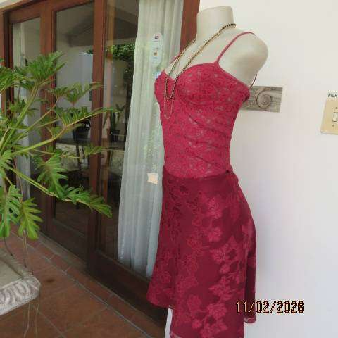 Dark red acrylic stretch strappy top-bustier in a very good condition. Size 34