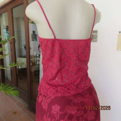 Dark red acrylic stretch strappy top-bustier in a very good condition. Size 34