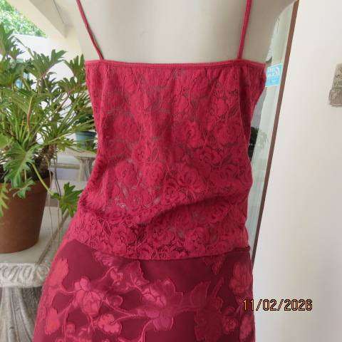 Dark red acrylic stretch strappy top-bustier in a very good condition. Size 34