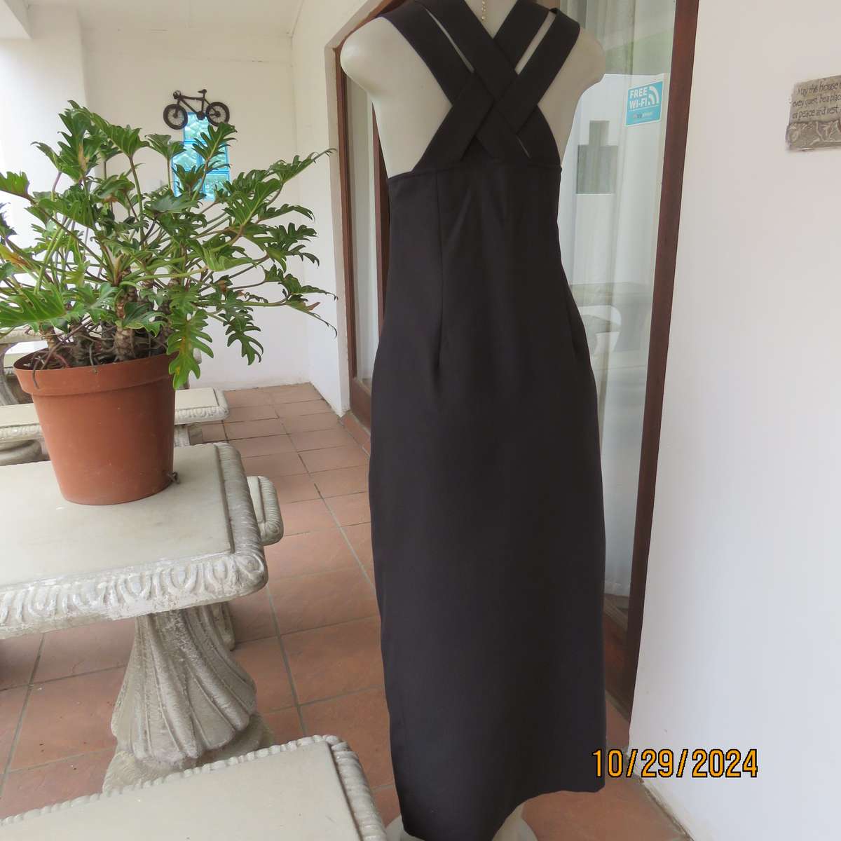 Beautiful black sleek button down ankle length dress by CHARLOTTE size 36. Criss cross strap back.