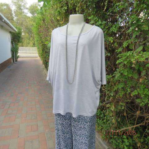 Light blue-grey slip over stretch polyester-rayon top with short cut-on sleeves. Size 42