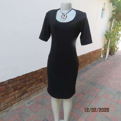 Very black textured stretch polyester slip over shift dress with long short sleeves. Size 36