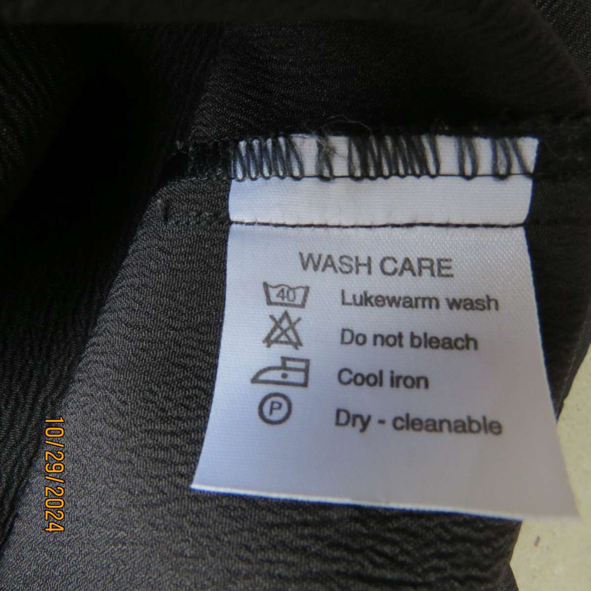 Beautiful black sleek button down ankle length dress by CHARLOTTE size 36. Criss cross strap back.