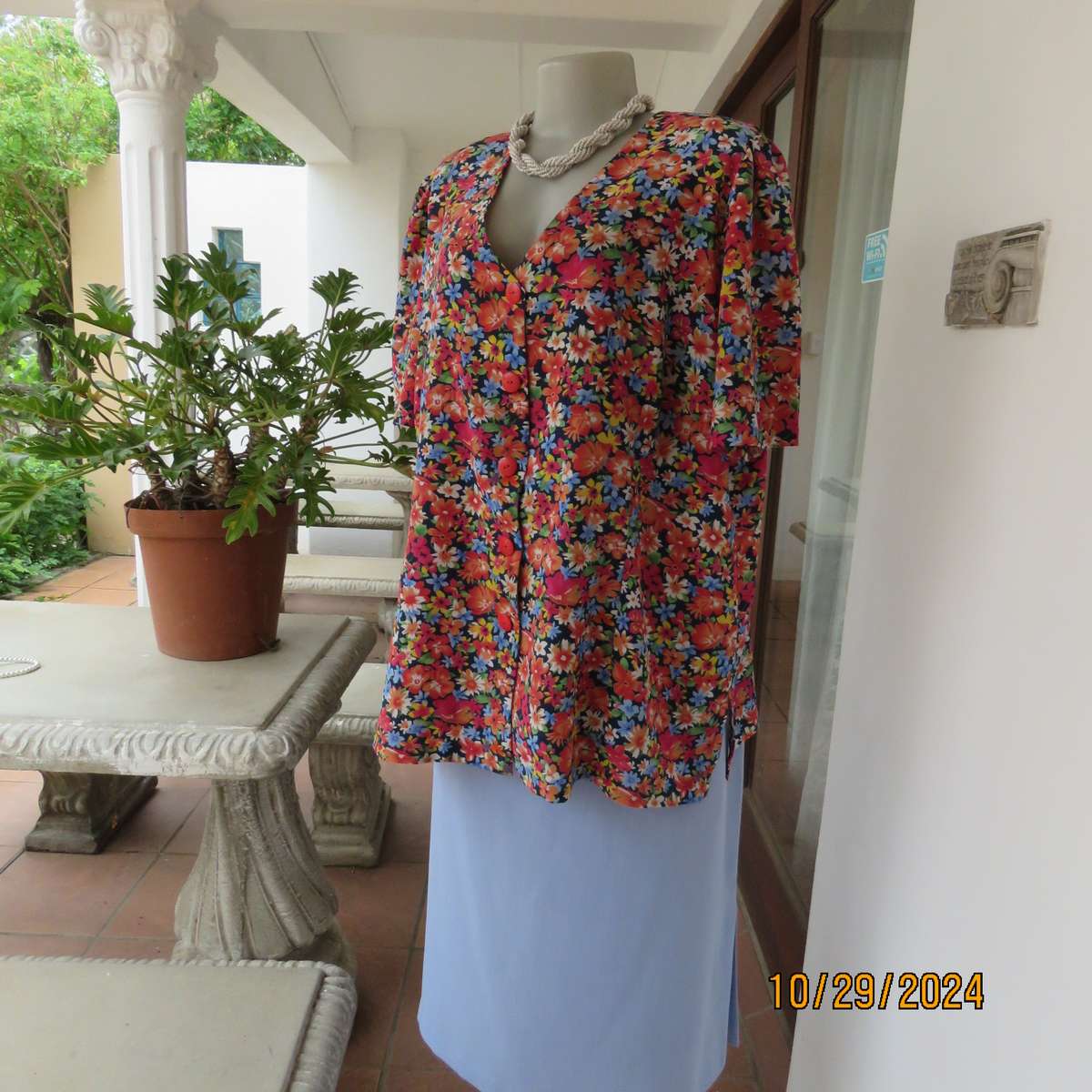 Silky polyester floral top in array of colours. V neck button down. Short sleeves. Size 46. As new