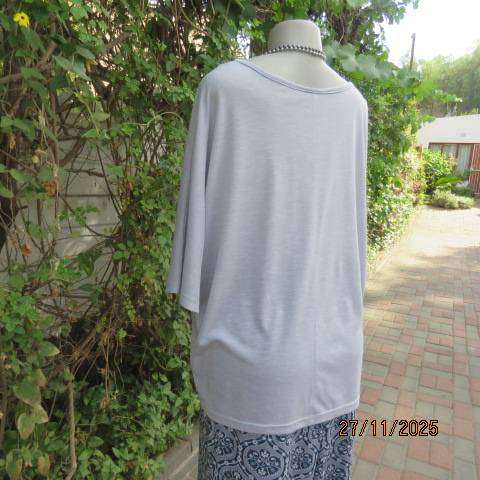 Light blue-grey slip over stretch polyester-rayon top with short cut-on sleeves. Size 42