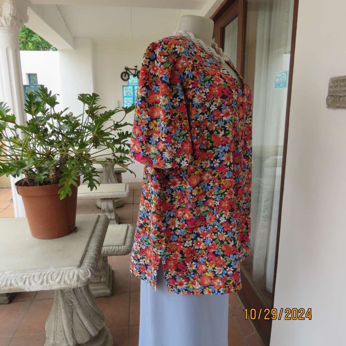Silky polyester floral top in array of colours. V neck button down. Short sleeves. Size 46. As new
