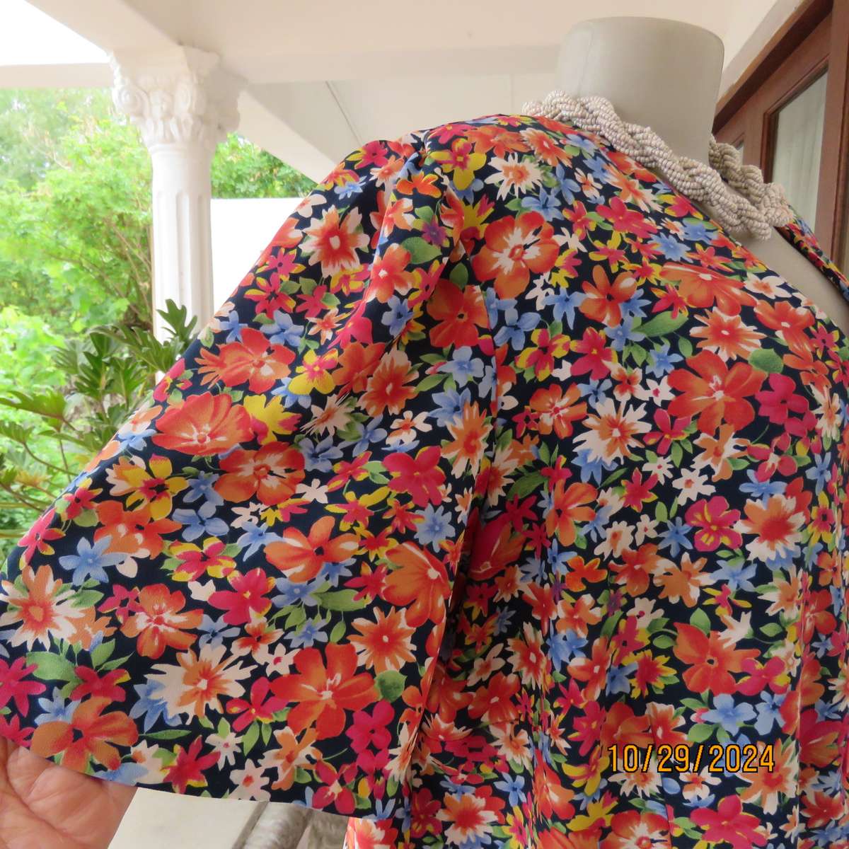 Silky polyester floral top in array of colours. V neck button down. Short sleeves. Size 46. As new