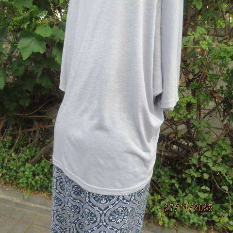 Light blue-grey slip over stretch polyester-rayon top with short cut-on sleeves. Size 42