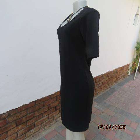 Very black textured stretch polyester slip over shift dress with long short sleeves. Size 36