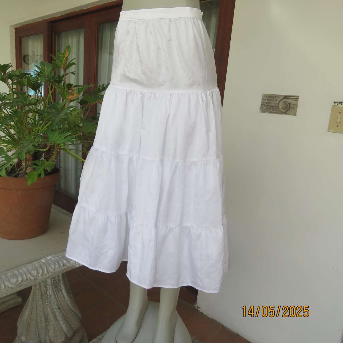 Boutique made white creased silky polyester tiered skirt. Underlayer with netting.Size 34