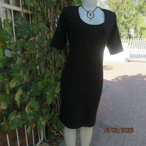 Very black textured stretch polyester slip over shift dress with long short sleeves. Size 36