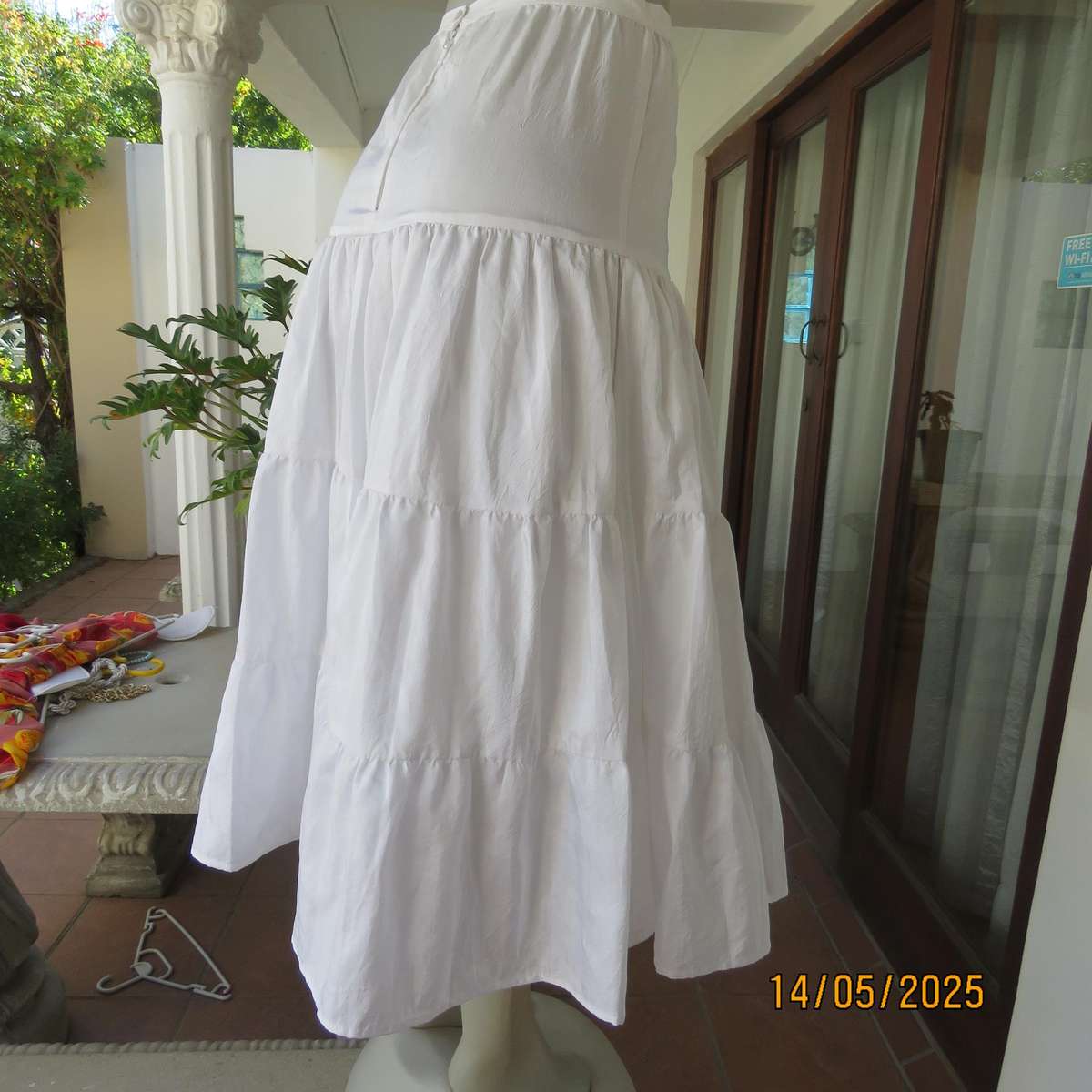 Boutique made white creased silky polyester tiered skirt. Underlayer with netting.Size 34
