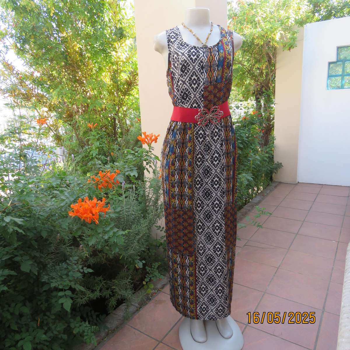 Ethnic patterned maxi polyester sleeveless dress. Elasticated waist. Size 34.