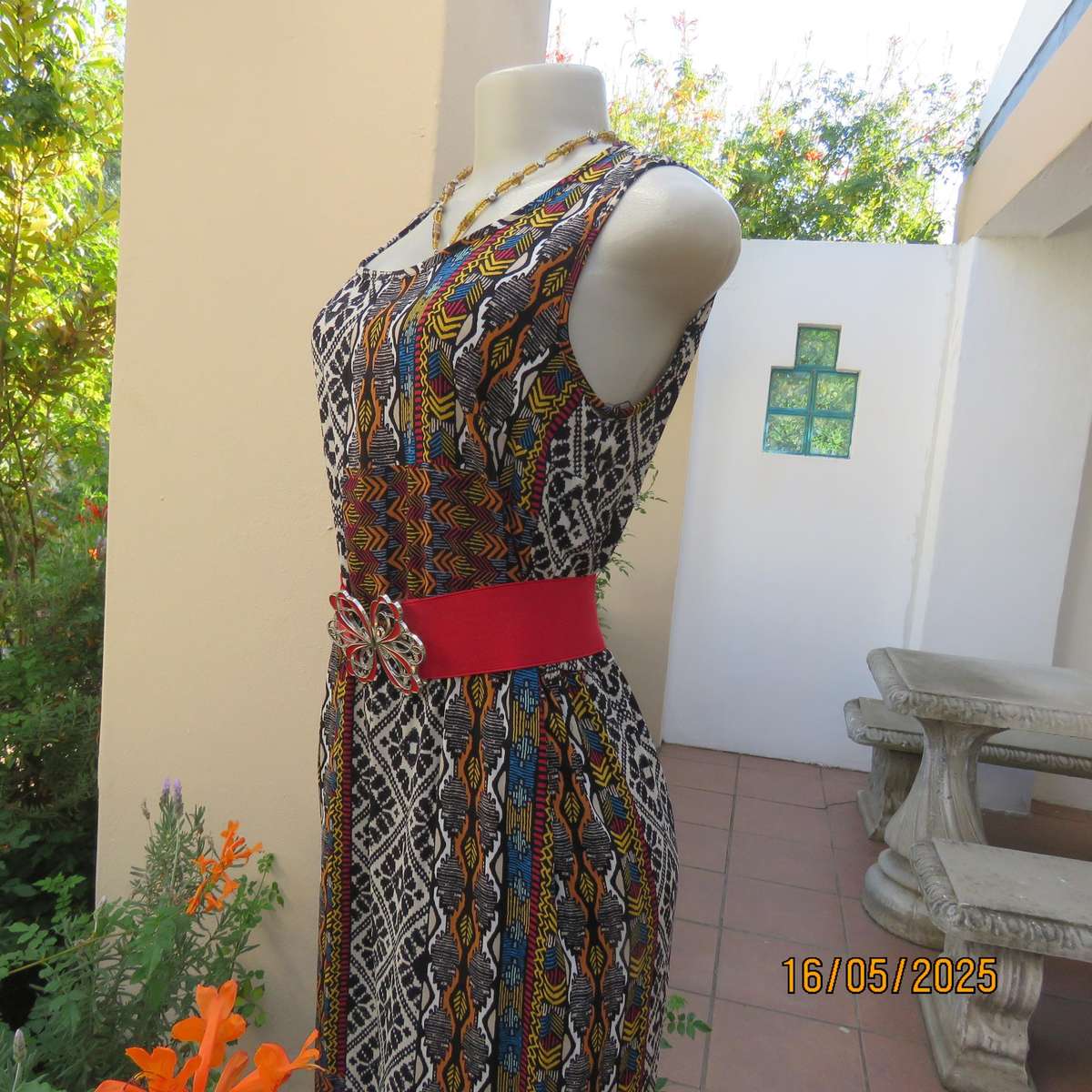Ethnic patterned maxi polyester sleeveless dress. Elasticated waist. Size 34.