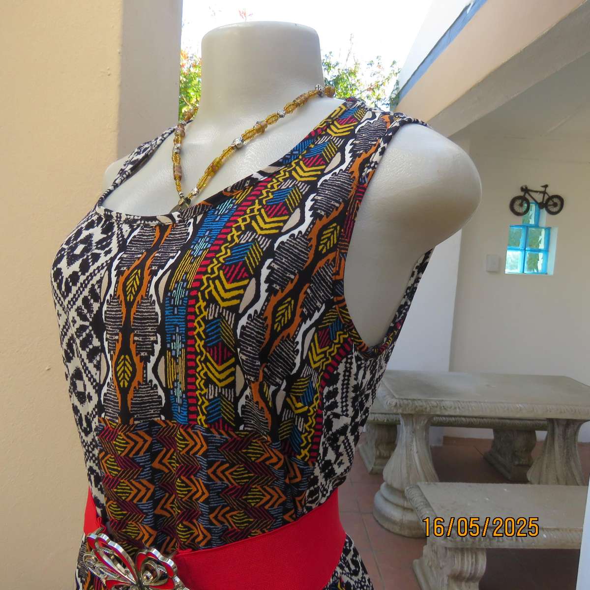 Ethnic patterned maxi polyester sleeveless dress. Elasticated waist. Size 34.