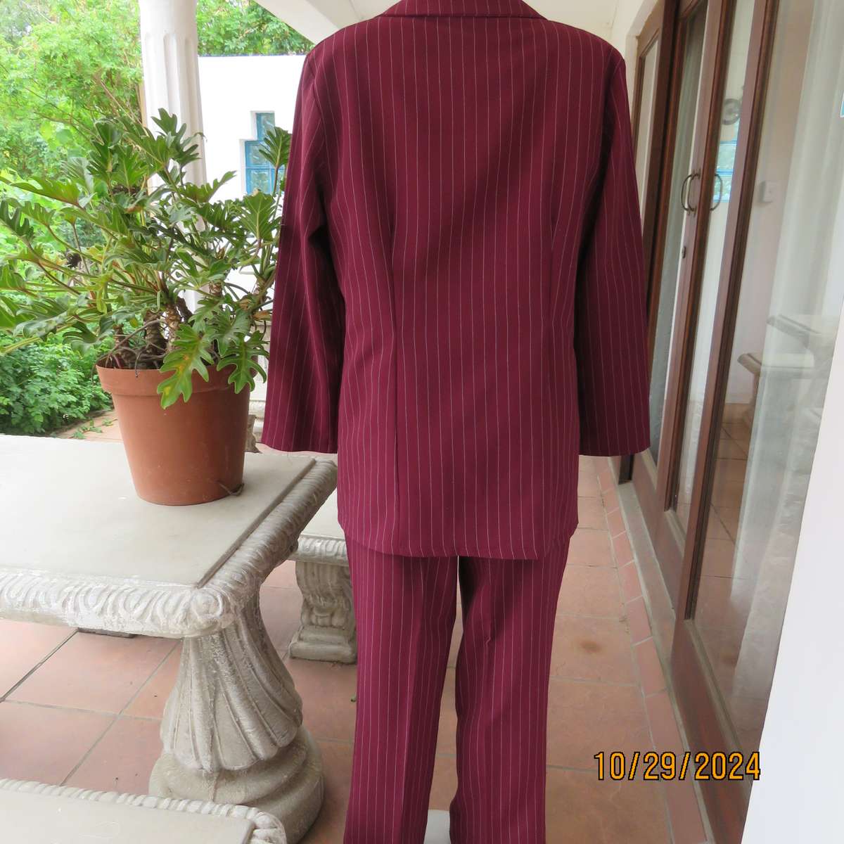 Classic maroon-white pinstripe 2 pc pantsuit. In 100% polyester. Tailored 1 button jacket. Size 40.