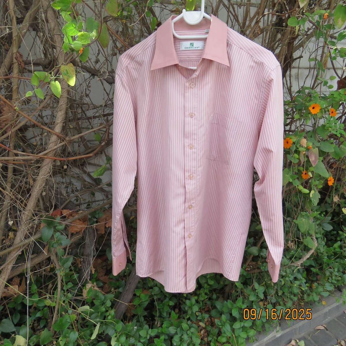 DIFANCHY vertical light peach with thin embossed white stripes. Size M