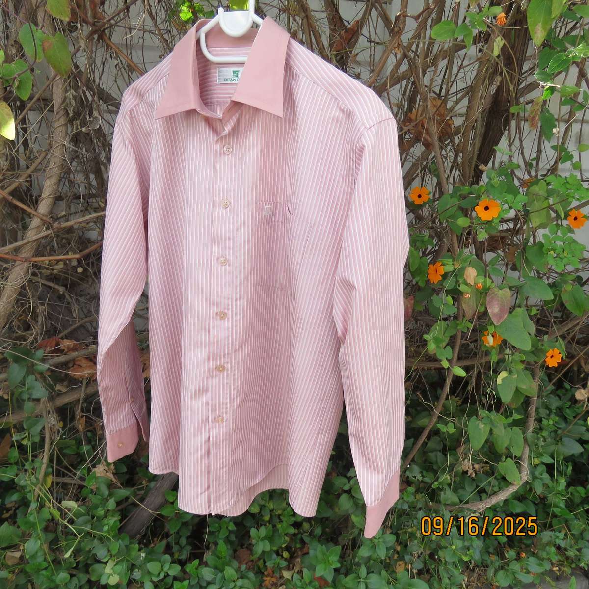 DIFANCHY vertical light peach with thin embossed white stripes. Size M