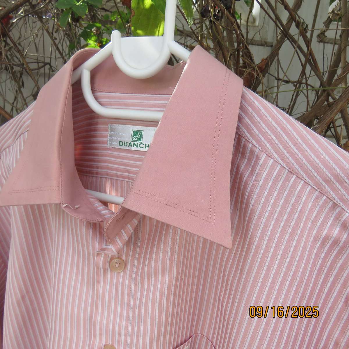 DIFANCHY vertical light peach with thin embossed white stripes. Size M