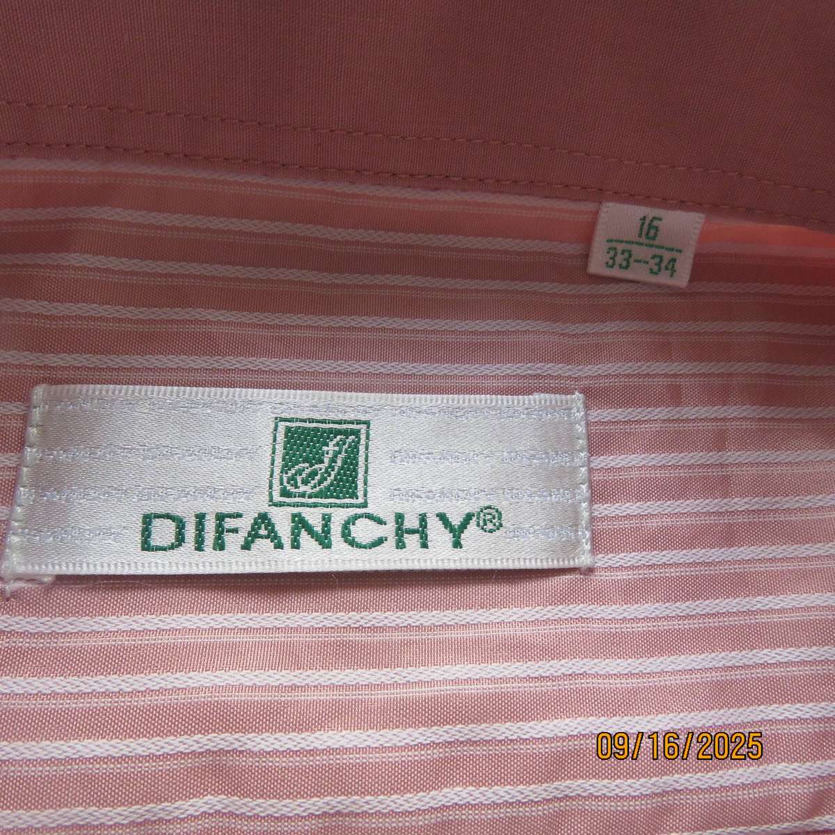 DIFANCHY vertical light peach with thin embossed white stripes. Size M