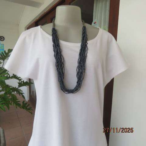 Casual white cotton slip over top with cut on short bell sleeves. Size 36