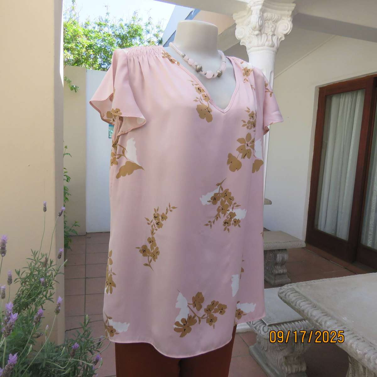 WOOLWORTHS slip over champagne peach with tan-white flowers capped sleeve top. Size 42