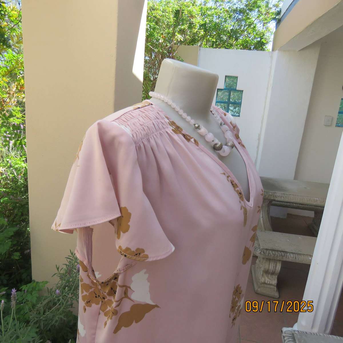 WOOLWORTHS slip over champagne peach with tan-white flowers capped sleeve top. Size 42