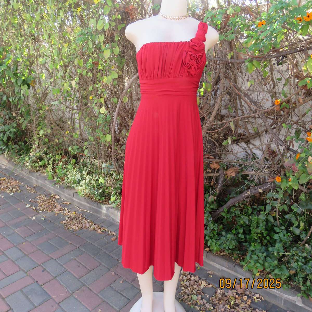 Dark red evening dress with permanent pleated bottom and 1 shoulder strap. Size 36