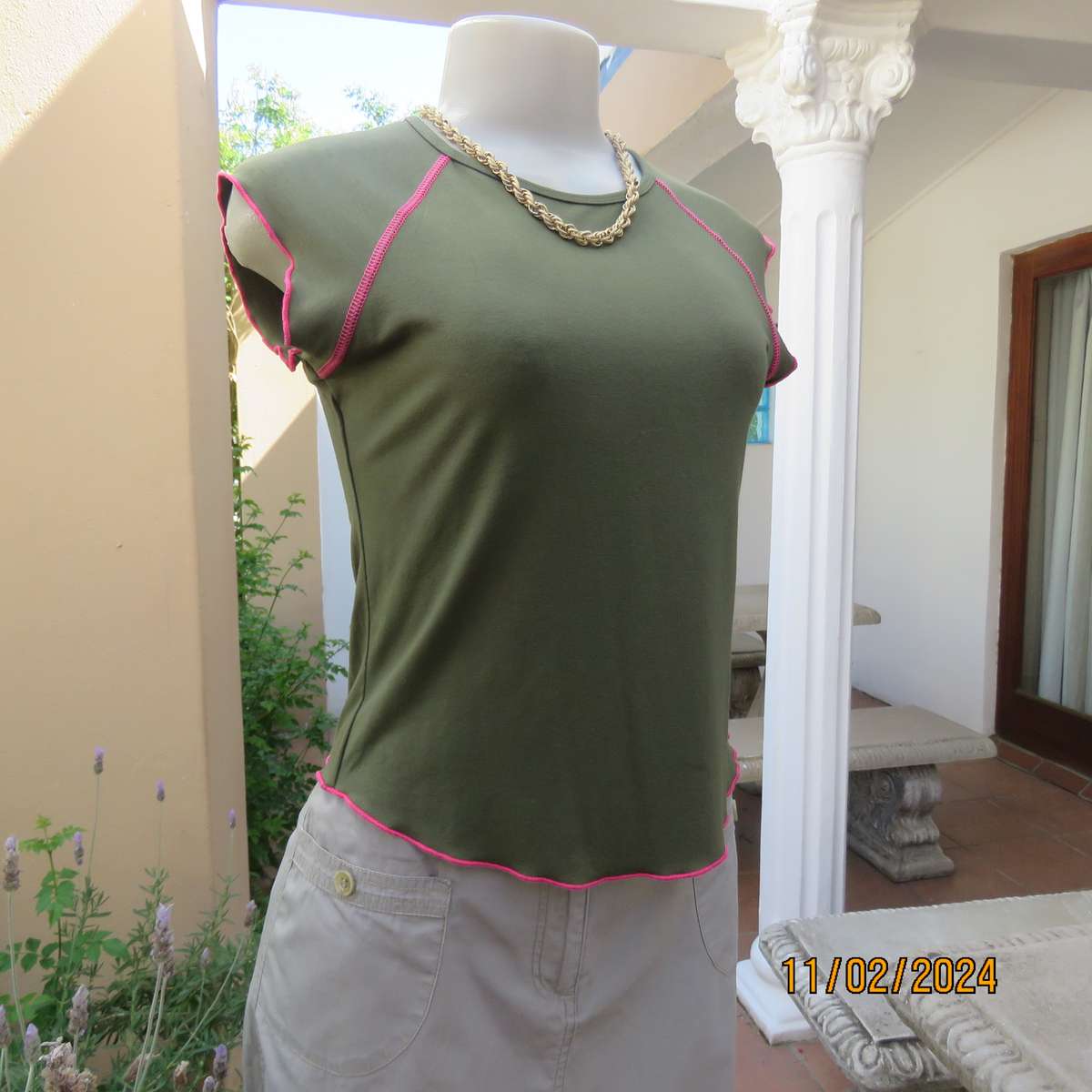 SISSY BOY olive green slip over size 32 top in stretch viscose. Pink edging. As new condition.