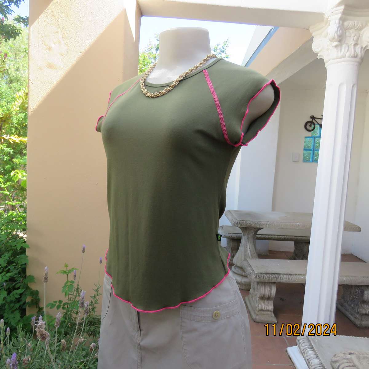SISSY BOY olive green slip over size 32 top in stretch viscose. Pink edging. As new condition.