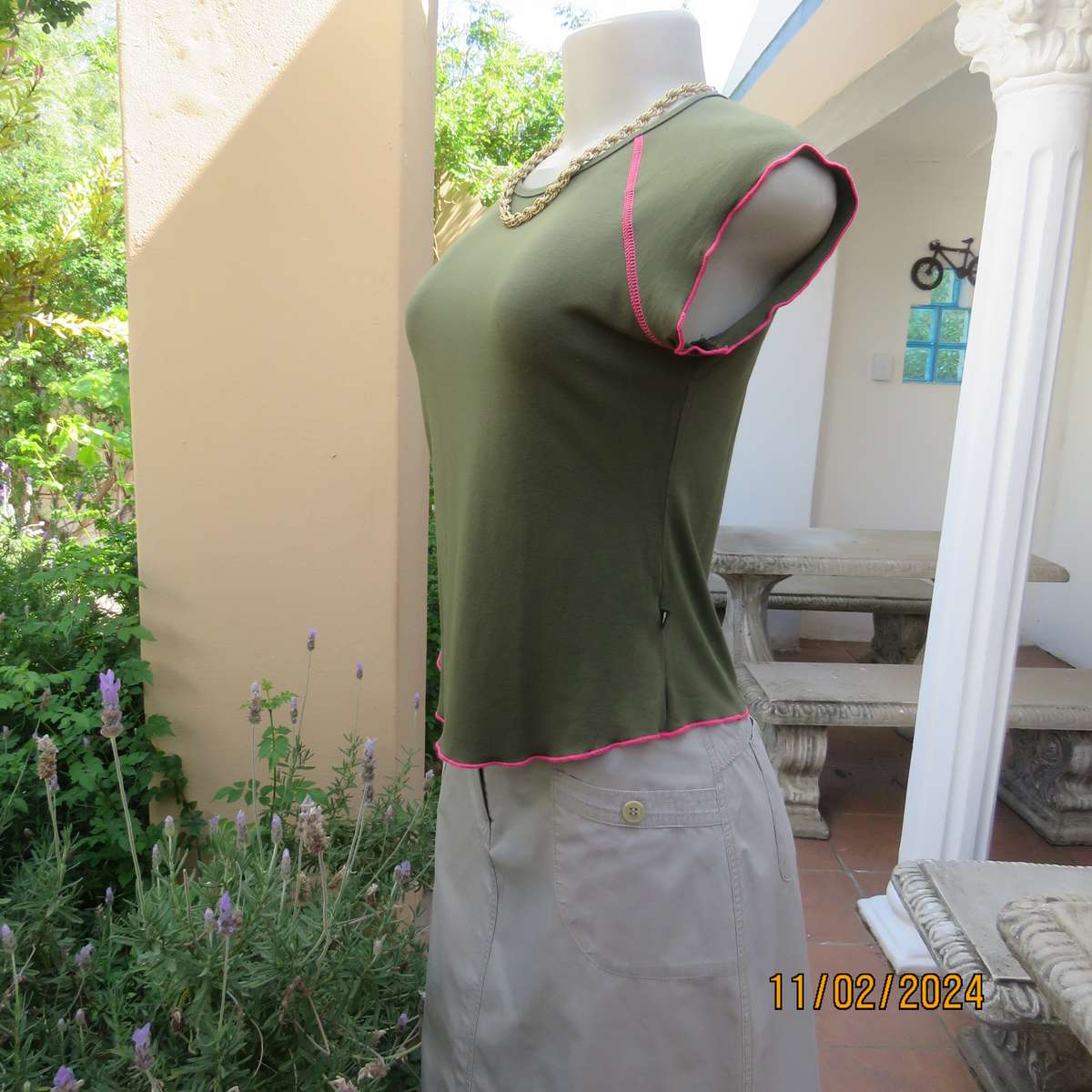 SISSY BOY olive green slip over size 32 top in stretch viscose. Pink edging. As new condition.