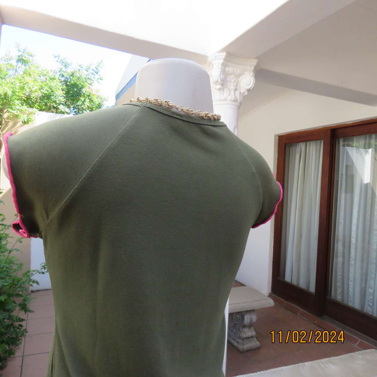 SISSY BOY olive green slip over size 32 top in stretch viscose. Pink edging. As new condition.