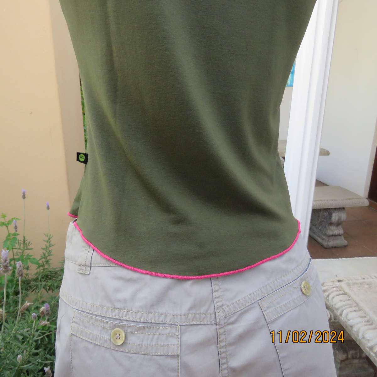 SISSY BOY olive green slip over size 32 top in stretch viscose. Pink edging. As new condition.