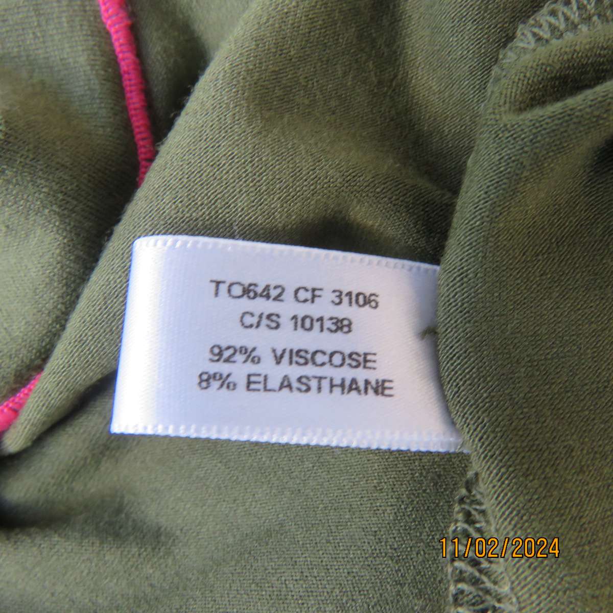 SISSY BOY olive green slip over size 32 top in stretch viscose. Pink edging. As new condition.