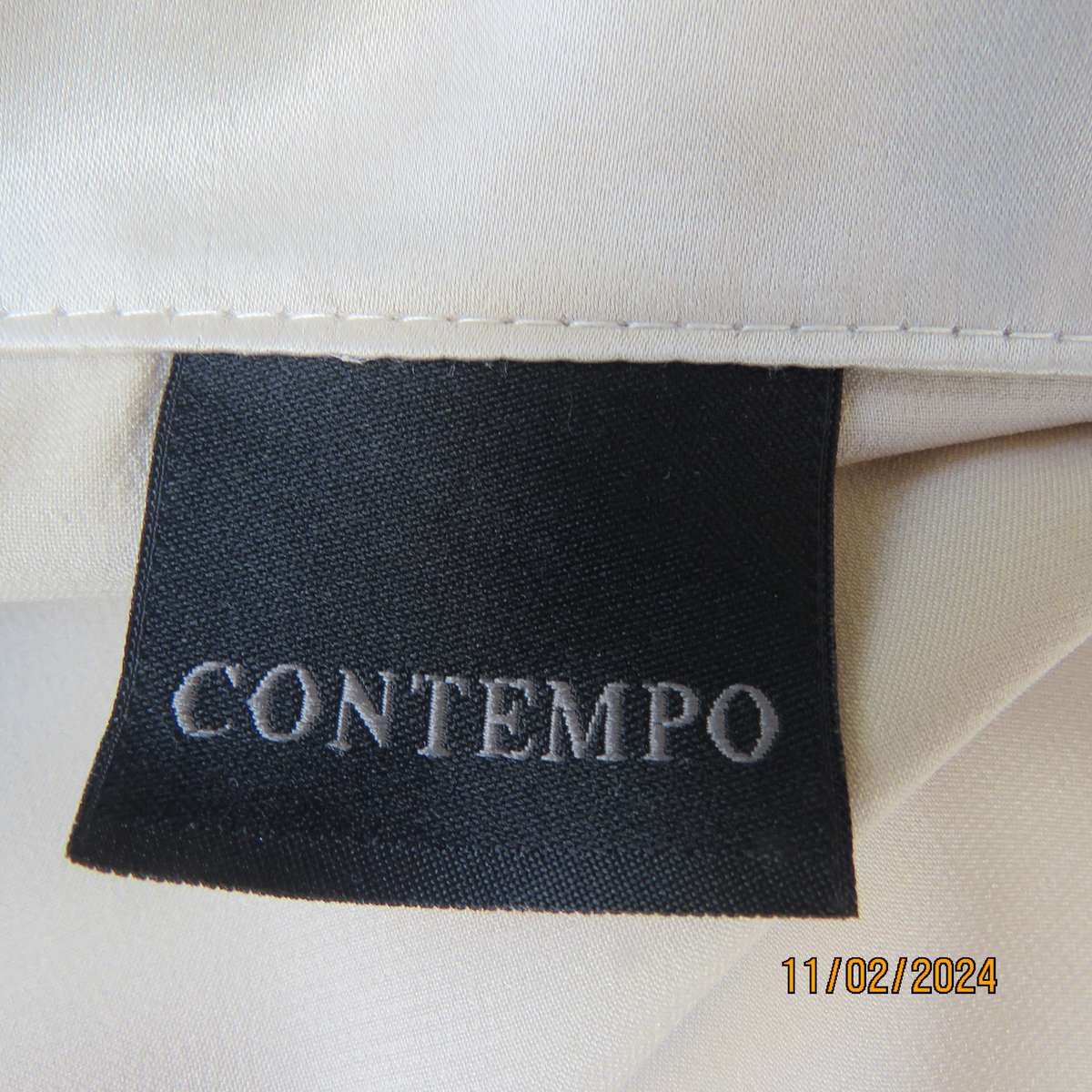 CONTEMPO rich cream stretch polyester short sleeve button down empire front top.Size 42.