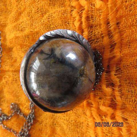 Chiastolite cross stone sphere pendant with metal band and chain