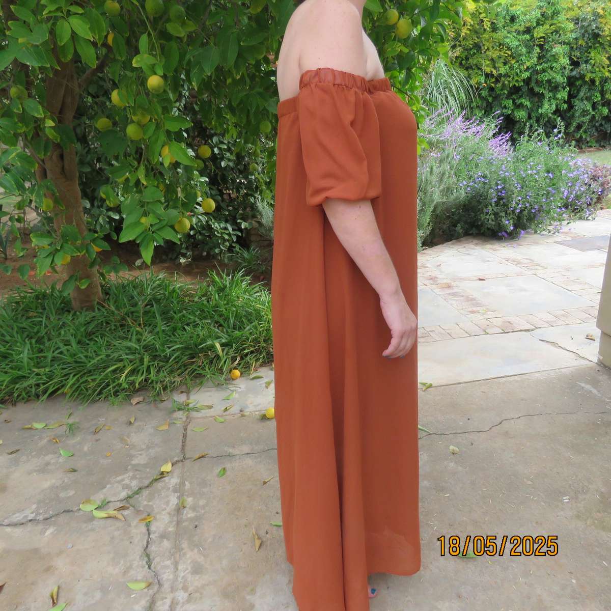 NEW FEELING rust colour loose hanging lined sheer polyester strapless dress. Size 34