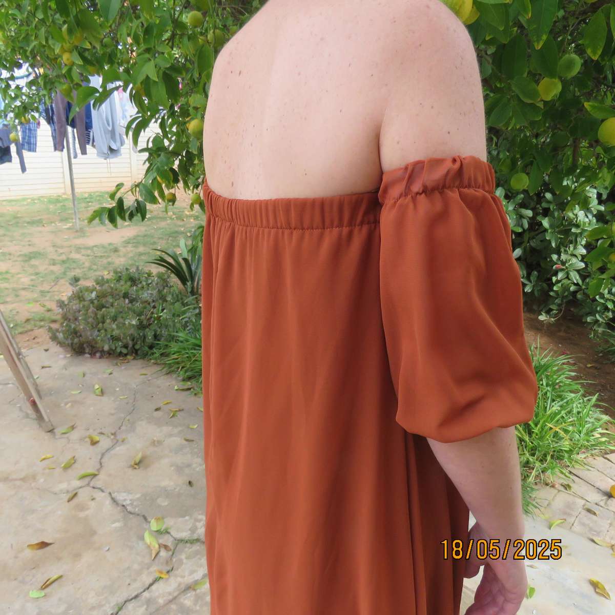 NEW FEELING rust colour loose hanging lined sheer polyester strapless dress. Size 34