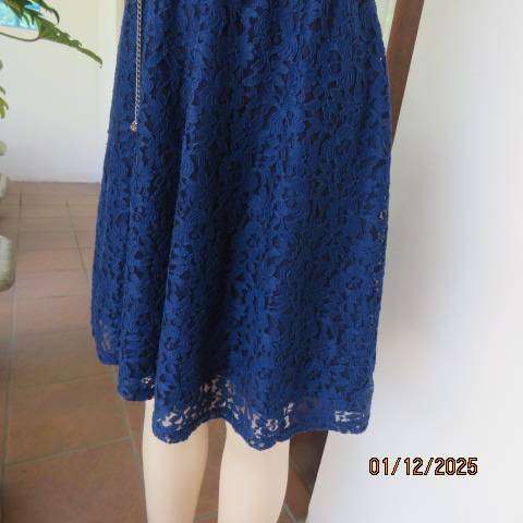 Berry blue sleeveless lace dress with stretch polyester lining. Elasticated waist. Size 30