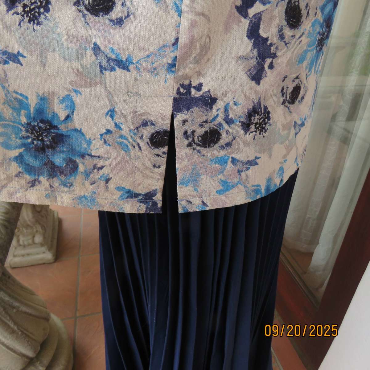Boutique made white woven polycotton top with blue-grey flowers. Short sleeves. Size 44
