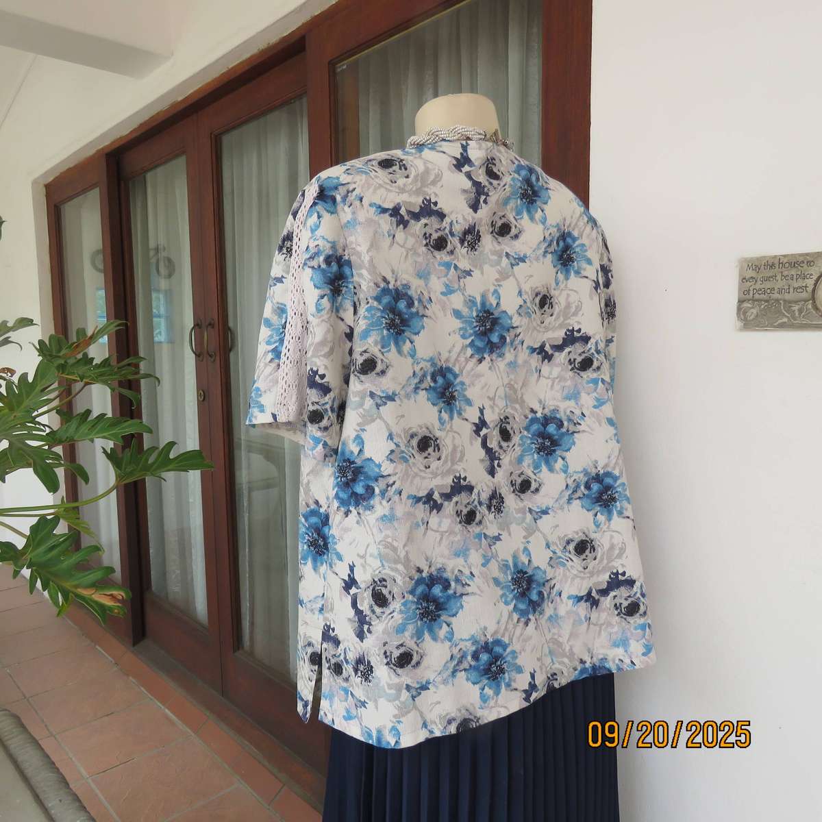 Boutique made white woven polycotton top with blue-grey flowers. Short sleeves. Size 44
