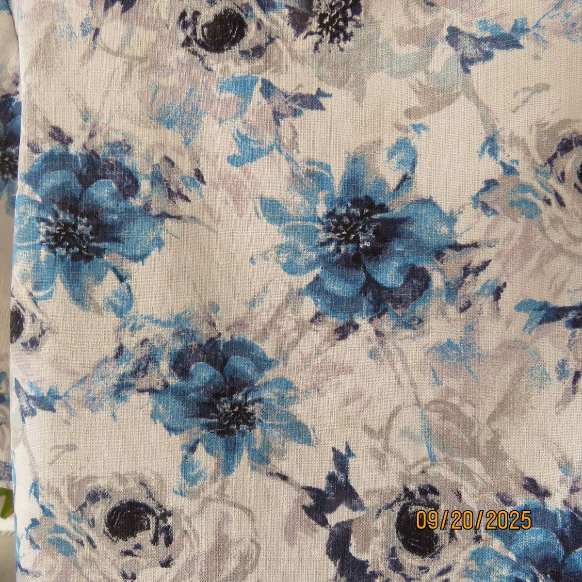 Boutique made white woven polycotton top with blue-grey flowers. Short sleeves. Size 44