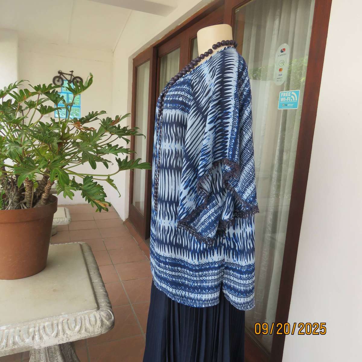 Horizontal patterned slip over top in medley of blues. Wide short raglan sleeves. Size 40