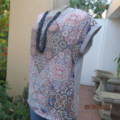 Tango top with silvergrey poly-rayon back and silky polyester graphic front, size 38