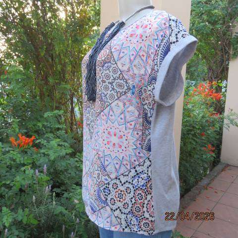 Tango top with silvergrey poly-rayon back and silky polyester graphic front, size 38