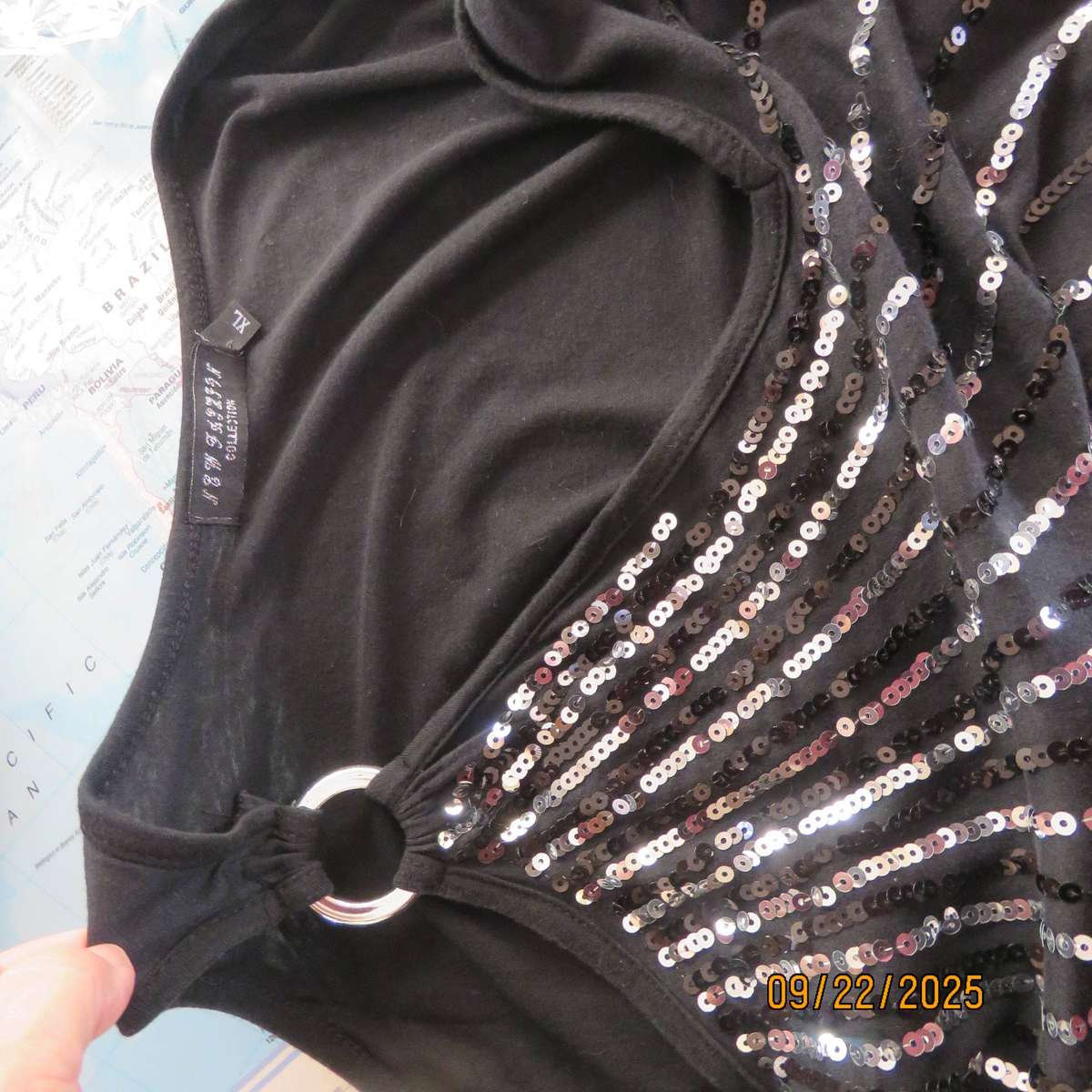 Black slip over glam top. Cut-on short sleeves. One open shoulder. Sequin decoration. Size 36