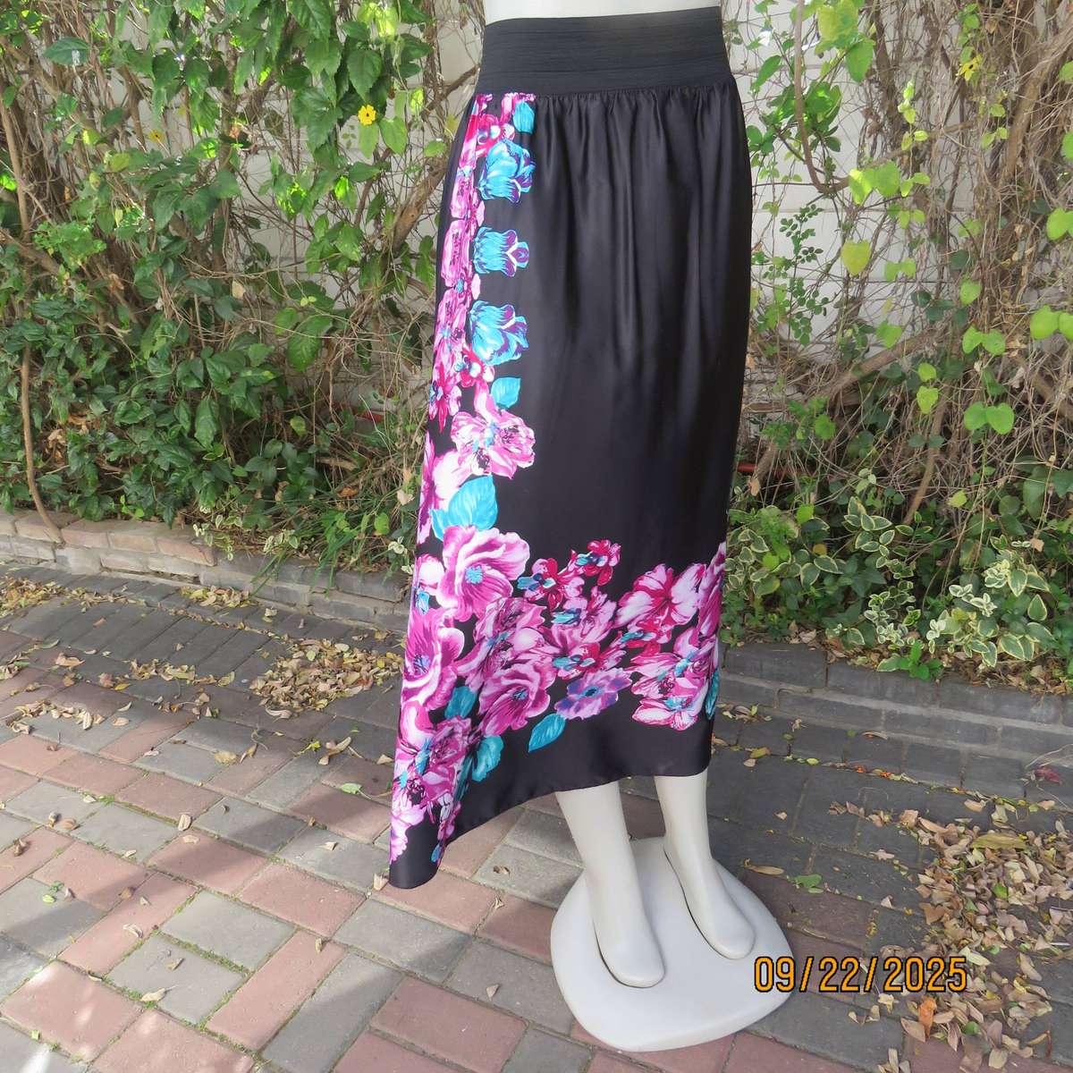 Black silky shiny polyester with pink-jade bold floral print maxi skirt. Elasticated waist. Size 42